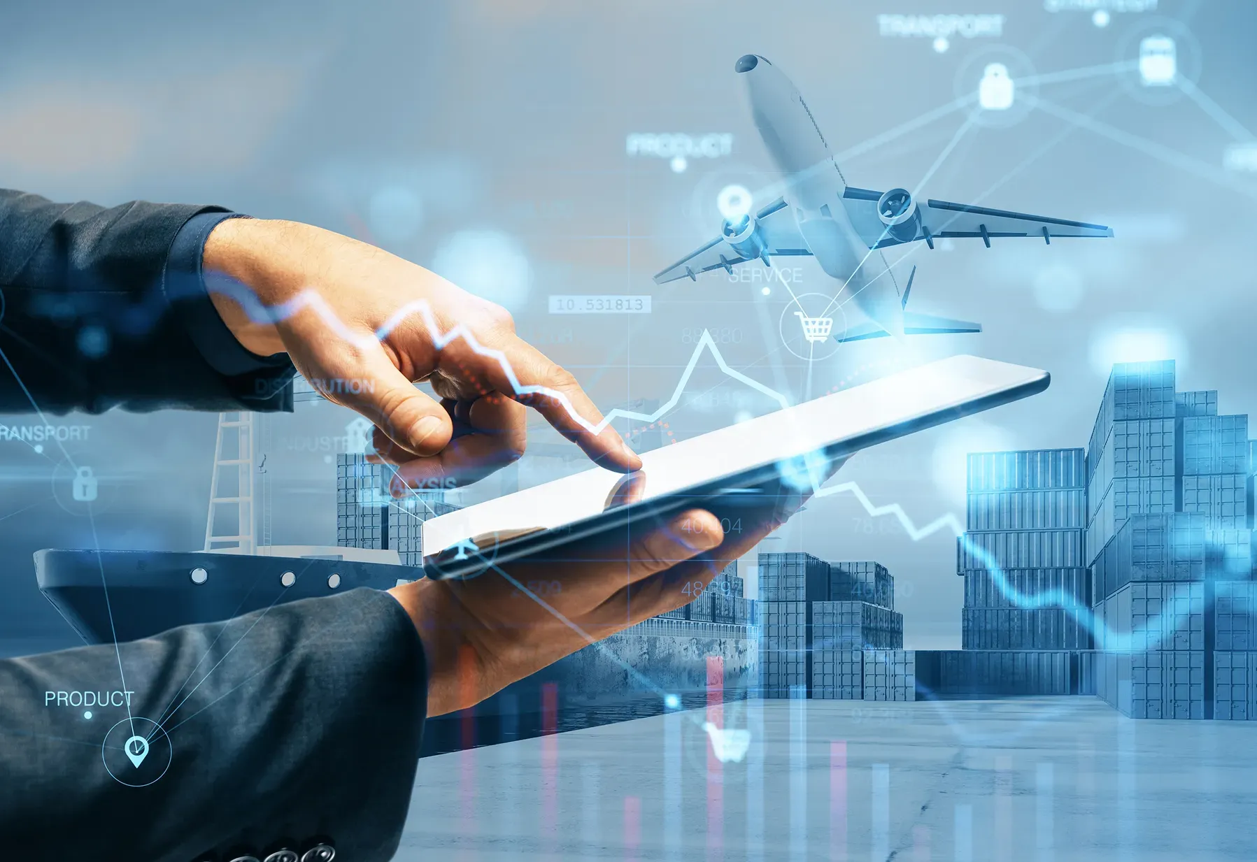 Hands using a tablet with digital logistics and aviation data overlays.