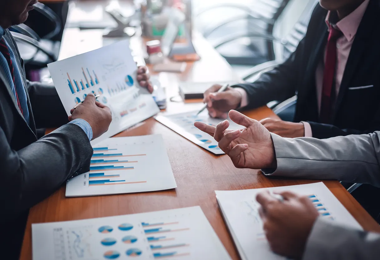 Business team reviewing data charts and graphs during a meeting